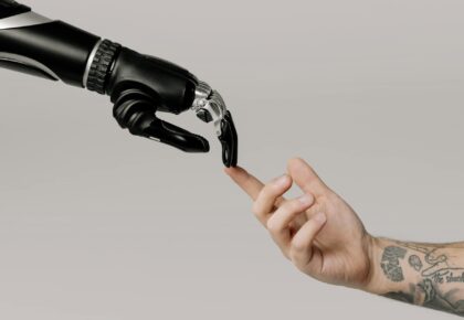 bionic hand and human hand finger pointing